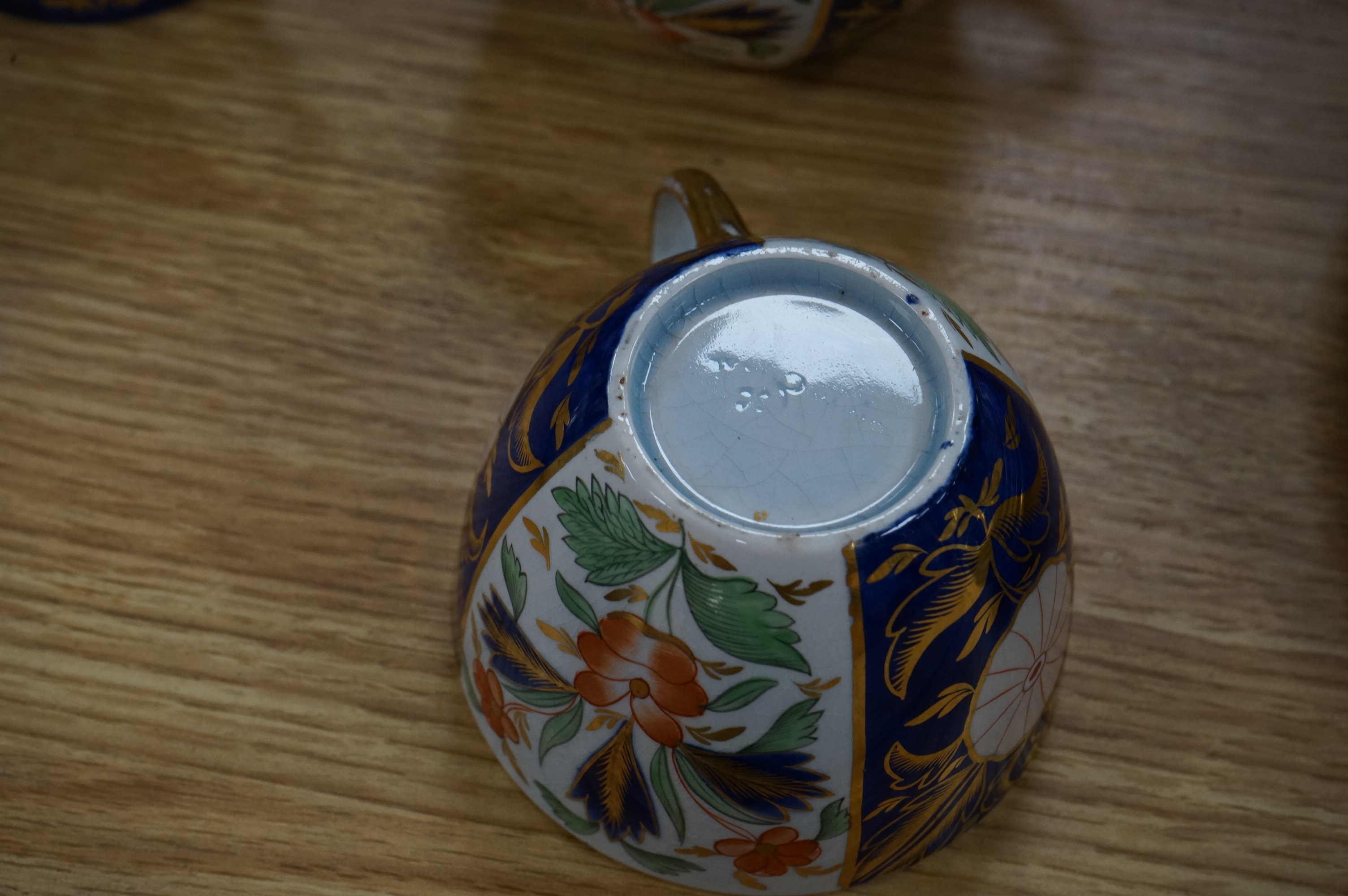 A Wedgwood Queensware Imari part tea set and a Masons Imari pattern bowl, bowl 25.5cm diameter. Condition - some wear to gilt decoration and crazing to interior of jug